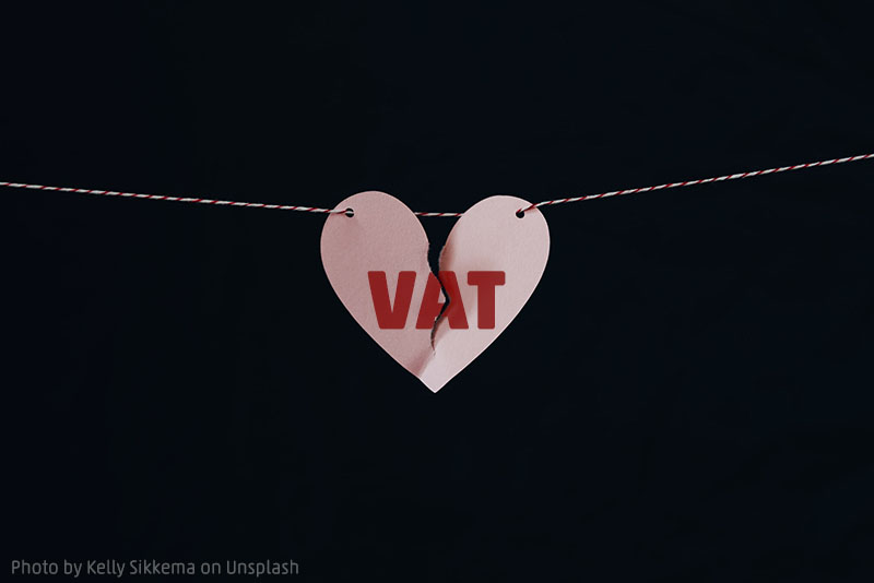 835 Torn Paperheart with word VAT on a String